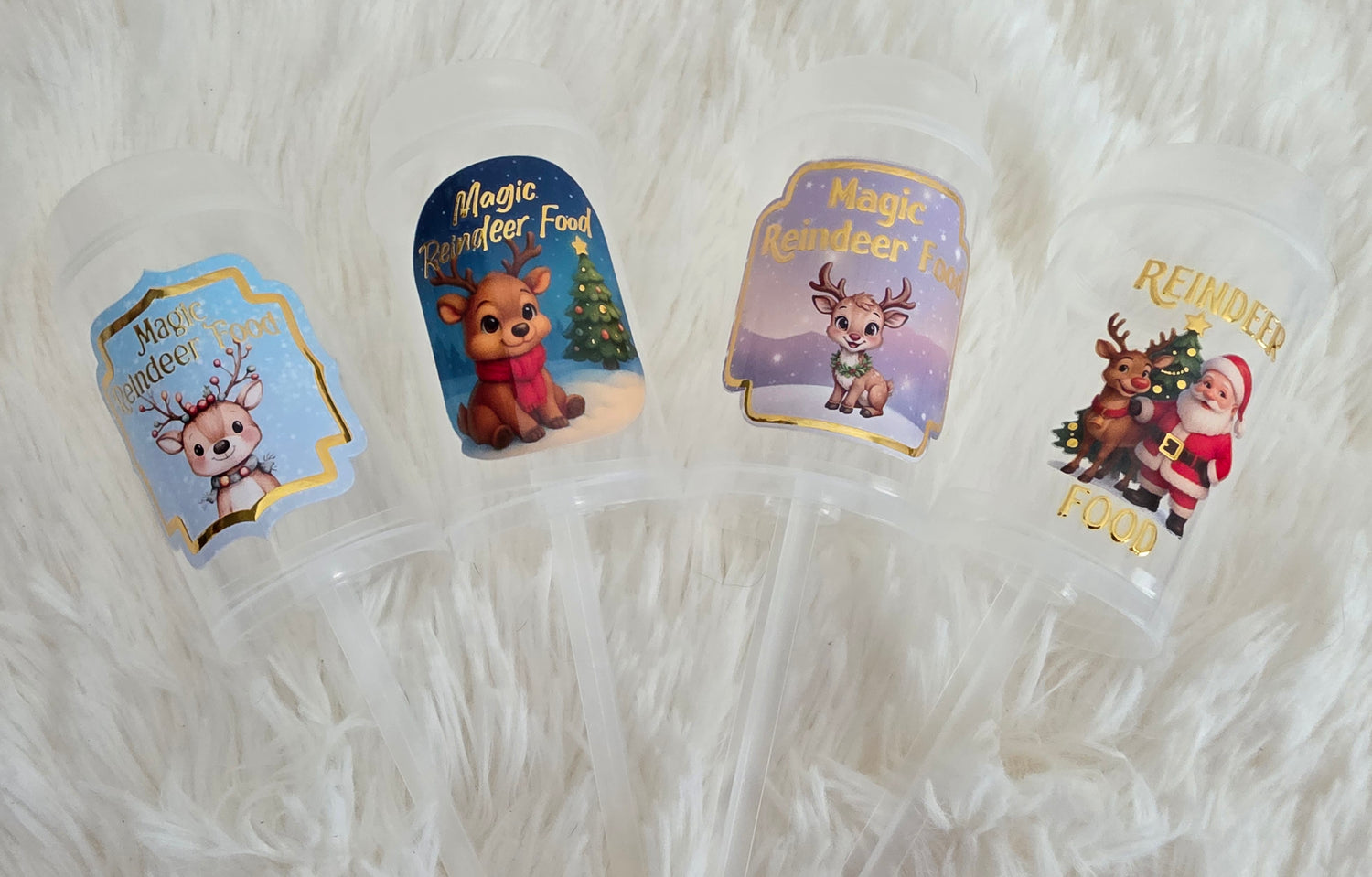 Four Christmas-themed reindeer food stickers on a white textured surface