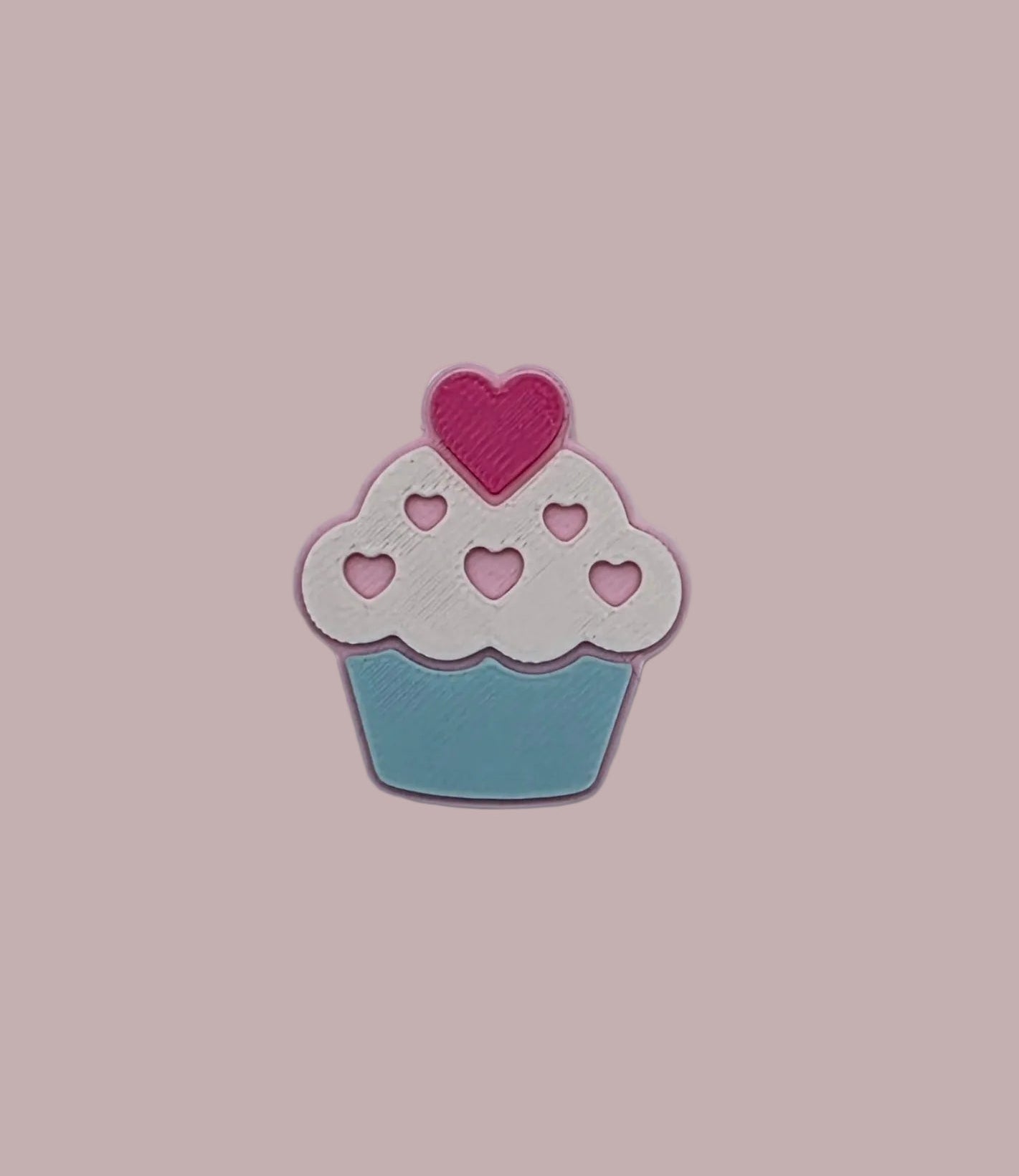 Cupcake-shaped pin with a pink heart 